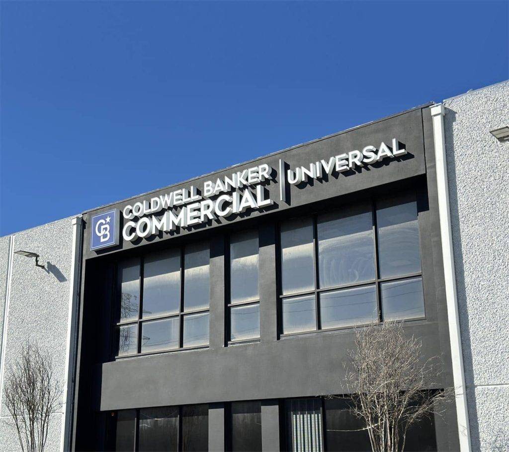 A sleek business sign displaying the Coldwell Banker Commercial logo and branding, showing professionalism and expertise