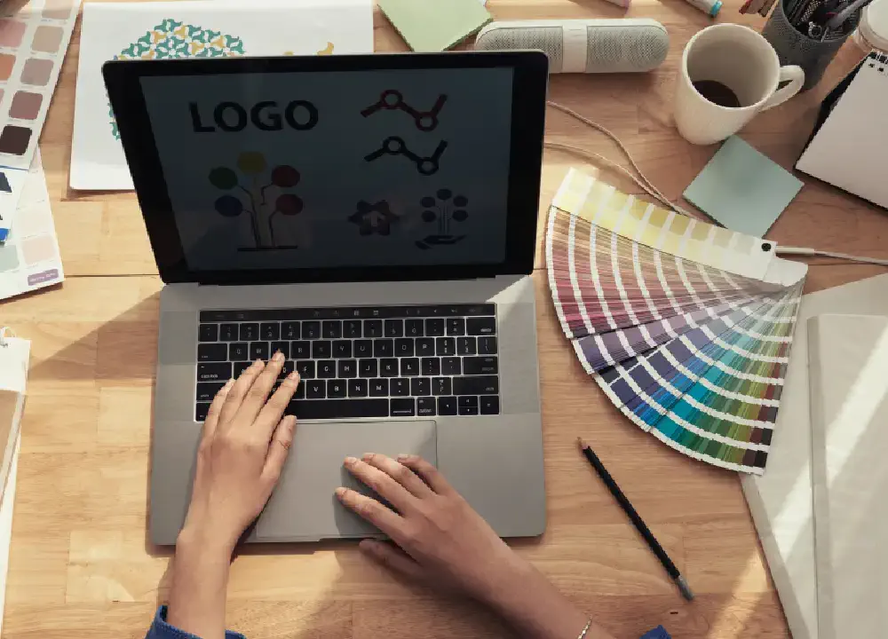 in a laptop designing logo 