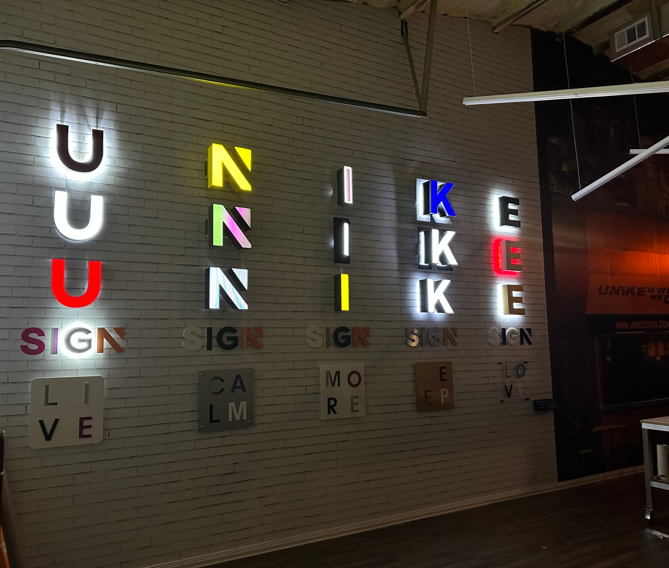 Uni Signs showroom displaying various channel letter sign styles and illumination options in Katy Texas