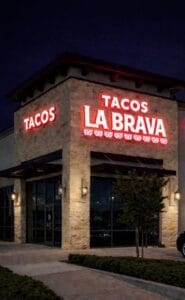 Illuminated channel letter storefront sign for restaurant in Katy Texas by Uni Signs